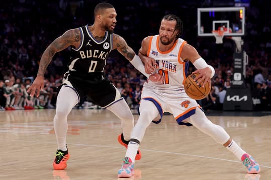 Jan 12, 2025; New York, New York, USA; New York Knicks guard Jalen Brunson (11) controls the ball against Milwaukee Bucks guard Damian Lillard (0) during the first quarter at Madison Square Garden. Mandatory Credit: Brad Penner-Imagn Images