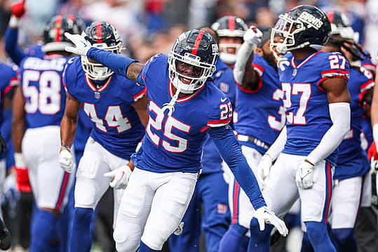 Oct 22, 2023; East Rutherford, New Jersey, USA; New York Giants cornerback Deonte Banks (25) celebrates after an interception against the Washington Commanders during the first half at MetLife Stadium. Mandatory Credit: Vincent Carchietta-USA TODAY Sports
