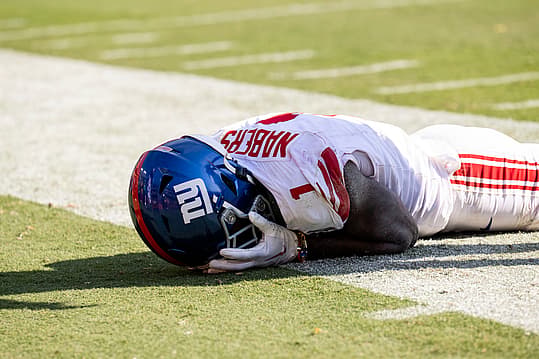 Sep 15, 2024; Landover, Maryland, USA; New York Giants wide receiver Malik Nabers (1) holds his face after dropping a pass against the Washington Commanders in the second half at Commanders Field. Mandatory Credit: Luke Johnson-Imagn Images