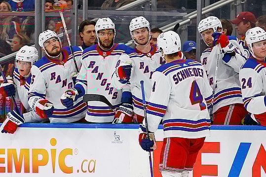The New York Rangers celebrate a goal scored by defensemen Braden Schneider (4) during the second period against the Edmonton Oilers at Rogers Place