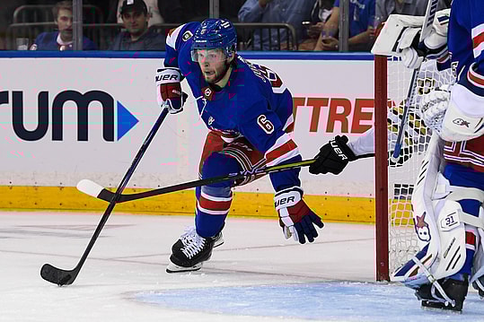 New York Rangers defenseman Zac Jones (6) skates with the puck from behind the net against the Boston Bruins during the second at Madison Square Garden