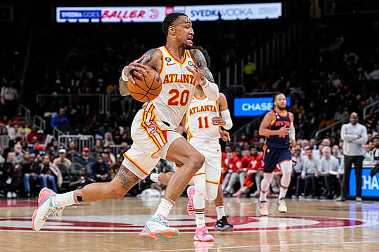 Atlanta Hawks forward John Collins (20) runs towards the basket against the New York Knicks during the second half at State Farm Arena