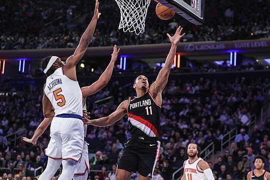Portland Trail Blazers guard Malcolm Brogdon (11) drives past New York Knicks forward Precious Achiuwa (5) for layup in the second quarter at Madison Square Garden