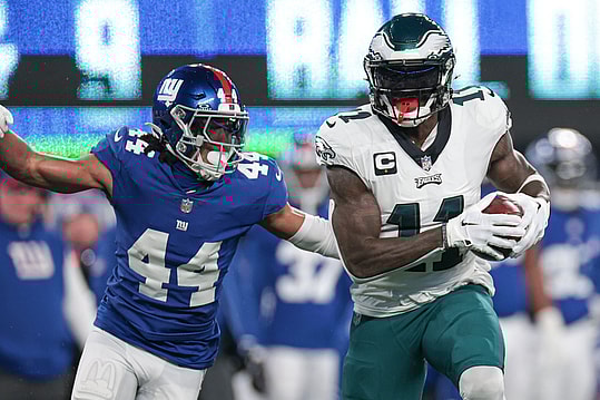 Philadelphia Eagles wide receiver A.J. Brown (11) catches the ball as New York Giants cornerback Nick McCloud (44) pursues during the first quarter at MetLife Stadium