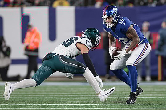 New York Giants tight end Darren Waller (12) makes a catch in front of Philadelphia Eagles safety Tristin McCollum (36) during the second half at MetLife Stadium