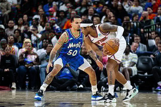 New York Knicks guard Josh Hart (3) dribbles the ball against the Orlando Magic guard Cole Anthony (50) in the fourth quarter at KIA Center. Mandatory Credit