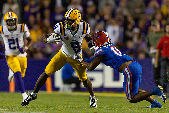 Nov 11, 2023; Baton Rouge, Louisiana, USA;  Florida Gators defensive end Kelby Collins (11) attempts to tackle LSU Tigers wide receiver Malik Nabers (8) during the second half at Tiger Stadium. Mandatory Credit: Stephen Lew-USA TODAY Sports
