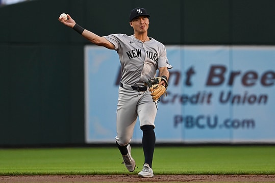 May 1, 2024; Baltimore, Maryland, USA;  New York Yankees shortstop Anthony Volpe (11) throws to first base during the first inning against the Baltimore Orioles at Oriole Park at Camden Yards. Mandatory Credit: Tommy Gilligan-USA TODAY Sports