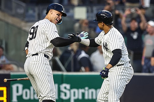 May 22, 2024; Bronx, New York, USA;  New York Yankees right fielder Juan Soto (22) celebrates with center fielder Aaron Judge (99) after hitting a two-run home run in the third inning against the Seattle Mariners at Yankee Stadium. Mandatory Credit: Wendell Cruz-USA TODAY Sports