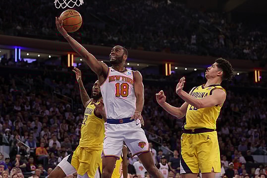 May 19, 2024; New York, New York, USA; New York Knicks guard Alec Burks (18) drives to the basket against Indiana Pacers forward Isaiah Jackson (22) and guard Ben Sheppard (26) during the fourth quarter of game seven of the second round of the 2024 NBA playoffs at Madison Square Garden. Mandatory Credit: Brad Penner-USA TODAY Sports