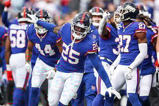 Oct 22, 2023; East Rutherford, New Jersey, USA; New York Giants cornerback Deonte Banks (25) celebrates after an interception against the Washington Commanders during the first half at MetLife Stadium. Mandatory Credit: Vincent Carchietta-USA TODAY Sports