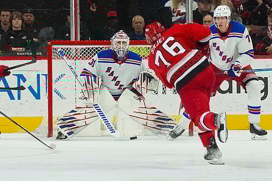 Mar 23, 2023; Raleigh, North Carolina, USA;  Carolina Hurricanes defenseman Brady Skjei (76) takes a shot at New York Rangers goaltender Igor Shesterkin (31) during the second period at PNC Arena. Mandatory Credit: James Guillory-USA TODAY Sports