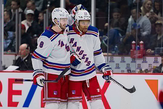 Feb 15, 2023; Vancouver, British Columbia, CAN; New York Rangers defenseman Jacob Trouba (8) celebrates defenseman K'Andre Miller (79) goal against the Vancouver Canucks in the second period at Rogers Arena. Mandatory Credit: Bob Frid-USA TODAY Sports