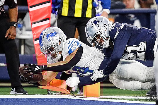 Lions wide receiver Amon-Ra St. Brown scores a touchdown against Cowboys cornerback Stephon Gilmore during the second half of the Lions' 20-19 loss at AT&T Stadium in Arlington, Texas on Saturday, Dec. 30, 2023.