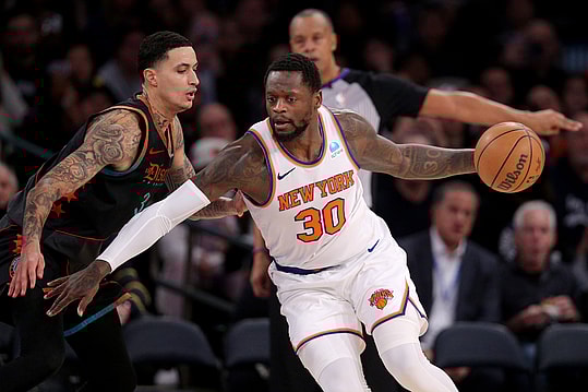 Jan 18, 2024; New York, New York, USA; New York Knicks forward Julius Randle (30) controls the ball against Washington Wizards forward Kyle Kuzma (33) during the third quarter at Madison Square Garden. Mandatory Credit: Brad Penner-USA TODAY Sports