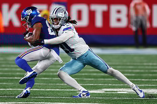 Sep 10, 2023; East Rutherford, New Jersey, USA; Dallas Cowboys cornerback Stephon Gilmore (21) tackles New York Giants wide receiver Darius Slayton (86) during the second half at MetLife Stadium. Mandatory Credit: Ed Mulholland-USA TODAY Sports
