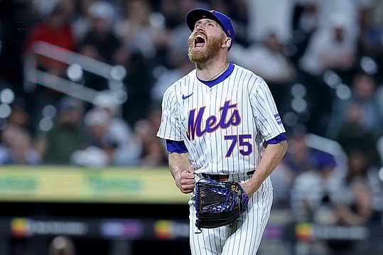 Jun 25, 2024; New York City, New York, USA; New York Mets relief pitcher Reed Garrett (75) reacts after getting the final out against the New York Yankees at Citi Field. Mandatory Credit: Brad Penner-USA TODAY Sports