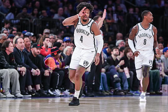 Mar 23, 2024; New York, New York, USA; Brooklyn Nets guard Dennis Smith Jr. (4) gestures after making a three point shot in the fourth quarter against the New York Knicks at Madison Square Garden. Mandatory Credit: Wendell Cruz-USA TODAY Sports