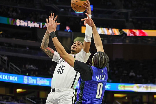 Feb 27, 2024; Orlando, Florida, USA; Brooklyn Nets guard Keon Johnson (45) goes to the basket against Orlando Magic guard Anthony Black (0) during the second half at Amway Center. Mandatory Credit: Mike Watters-USA TODAY Sports