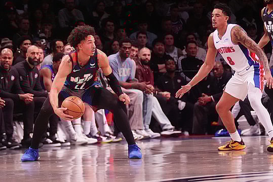 Apr 6, 2024; Brooklyn, New York, USA; Brooklyn Nets forward Jalen Wilson (22) grabs a loose ball against the Detroit Pistons during the first half at Barclays Center. Mandatory Credit: Gregory Fisher-USA TODAY Sports