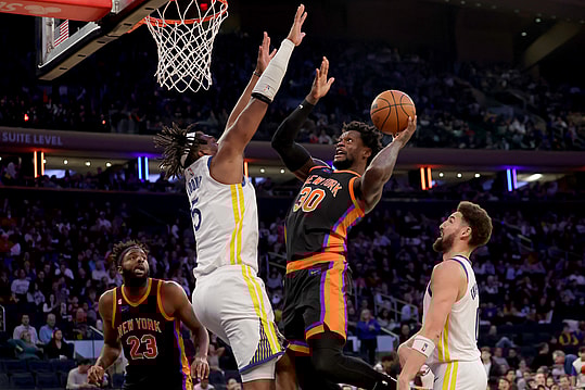Dec 20, 2022; New York, New York, USA; New York Knicks forward Julius Randle (30) drives to the basket against Golden State Warriors center Kevon Looney (5) during the third quarter at Madison Square Garden. Mandatory Credit: Brad Penner-USA TODAY Sports