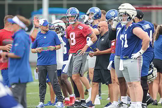 Jul 24, 2024; East Rutherford, NJ, USA; New York Giants quarterback Daniel Jones (8) talks with head coach Brian Dabol during training camp at Quest Diagnostics Training Facility. Mandatory Credit: Vincent Carchietta-USA TODAY Sports