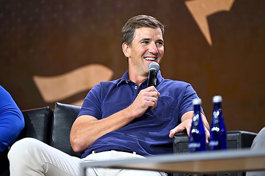 NEW YORK, NEW YORK (GIANTS) - AUGUST 16: Eli Manning speaks onstage at the Fanatics Fest NYC 2024 at Jacob Javits Center on August 16, 2024 in New York City.  (Photo by Roy Rochlin/Getty Images for Fanatics)
