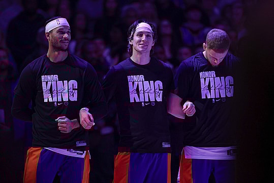 Jan 15, 2024; New York, New York, USA; New York Knicks guard Josh Hart (3), guard Ryan Arcidiacono (51), and guard Donte DiVincenzo (0) stand for the national anthem while wearing shirts honoring Martin Luther King Jr. before the game against the Orlando Magic at Madison Square Garden. Mandatory Credit: Vincent Carchietta-Imagn Images