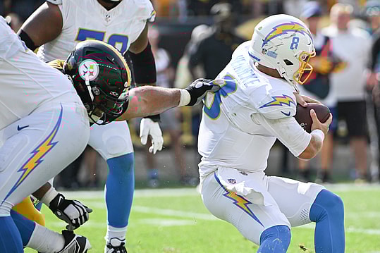 Sep 22, 2024; Pittsburgh, Pennsylvania, USA; PPittsburgh Steelers defensive tackle Cameron Heyward (97) sacks Los Angeles Chargers quarterback Taylor Heinicke (8) during the fourth quarter at Acrisure Stadium. Mandatory Credit: Barry Reeger-Imagn Images