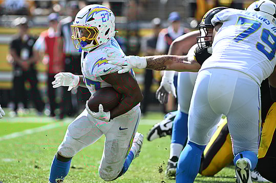 Sep 22, 2024; Pittsburgh, Pennsylvania, USA; Los Angeles Chargers running back J.K. Dobbins (27) gains yardage against the Pittsburgh Steelers during the third quarter at Acrisure Stadium. Mandatory Credit: Barry Reeger-Imagn Images
