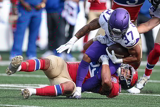 Sep 8, 2024; East Rutherford, New Jersey, USA; Minnesota Vikings running back Miles Gaskin (37) is tackled by New York Giants linebacker Darius Muasau (53) during the second half at MetLife Stadium. Mandatory Credit: Vincent Carchietta-Imagn Images