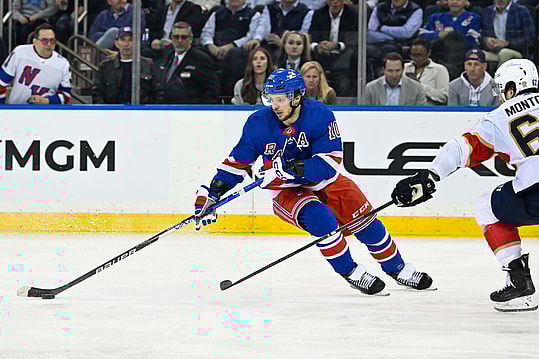 May 30, 2024; New York, New York, USA; New York Rangers left wing Artemi Panarin (10) skates with the puck as Florida Panthers defenseman Brandon Montour (62) defends during the third period in game five of the Eastern Conference Final of the 2024 Stanley Cup Playoffs at Madison Square Garden. Mandatory Credit: Dennis Schneidler-Imagn Images