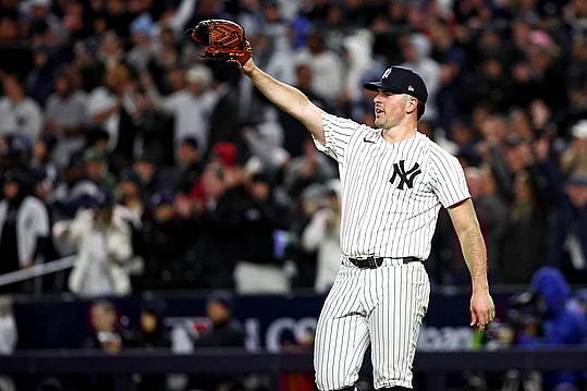 Oct 14, 2024; Bronx, New York, USA; New York Yankees pitcher Carlos Rodón (55) celebrates after a fly ball was caught to end the sixth inning against the Cleveland Guardians in game one of the ALCS for the 2024 MLB Playoffs at Yankee Stadium. Mandatory Credit: Wendell Cruz-Imagn Images