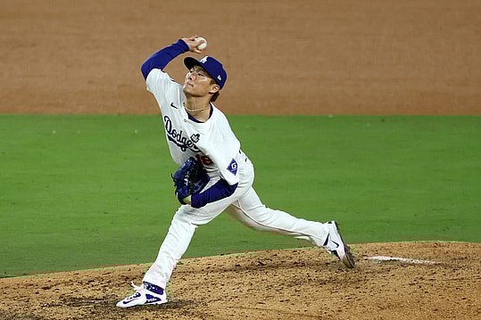 Oct 26, 2024; Los Angeles, California, USA; Los Angeles Dodgers pitcher Yoshinobu Yamamoto (18) throws a pitch against the New York Yankees in the seventh inning for game two of the 2024 MLB World Series at Dodger Stadium. Mandatory Credit: Kiyoshi Mio-Imagn Images