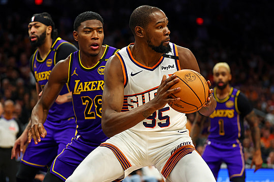 Oct 28, 2024; Phoenix, Arizona, USA; Phoenix Suns forward Kevin Durant (35) handles the ball against Los Angeles Lakers forward Rui Hachimura (28) during the second half at Footprint Center. Mandatory Credit: Mark J. Rebilas-Imagn Images
