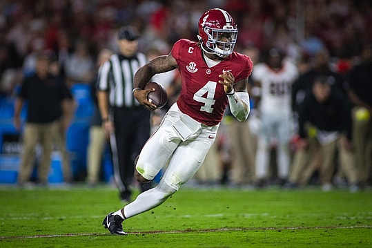 Sep 28, 2024; Tuscaloosa, Alabama, USA; Alabama Crimson Tide quarterback Jalen Milroe (4)(New York Giants prospect) runs against the Georgia Bulldogs during the first quarter at Bryant-Denny Stadium. Mandatory Credit: Will McLelland-Imagn Images