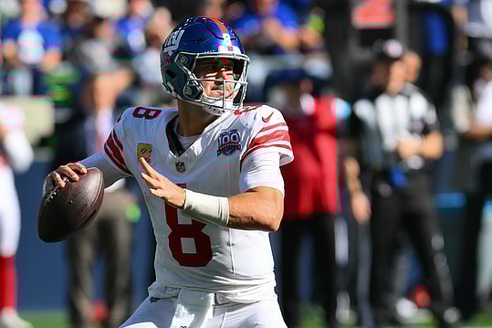 Oct 6, 2024; Seattle, Washington, USA; New York Giants quarterback Daniel Jones (8) passes the ball against the Seattle Seahawks at Lumen Field. Mandatory Credit: Steven Bisig-Imagn Images