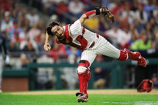 Sep 9, 2024; Philadelphia, Pennsylvania, USA; Philadelphia Phillies catcher Garrett Stubbs (21) fields a ball Tampa Bay Rays at Citizens Bank Park. Mandatory Credit: Bill Streicher-Imagn Images
