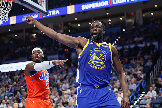 Nov 10, 2024; Oklahoma City, Oklahoma, USA; Golden State Warriors forward Draymond Green (23) and Oklahoma City Thunder guard Luguentz Dort (5) react after a play during the second quarter at Paycom Center. Mandatory Credit: Alonzo Adams-Imagn Images