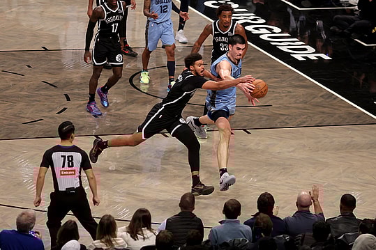 Nov 4, 2024; Brooklyn, New York, USA; Memphis Grizzlies center Zach Edey (14) fights for a loose ball against Brooklyn Nets forward Cameron Johnson (2) and center Nic Claxton (33) during the fourth quarter at Barclays Center. Mandatory Credit: Brad Penner-Imagn Images