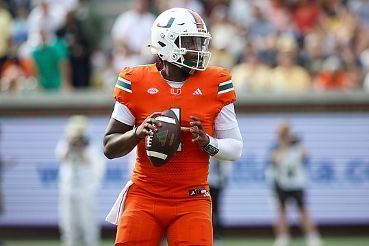 Nov 9, 2024; Atlanta, Georgia, USA; Miami Hurricanes quarterback Cam Ward (1) drops back to pass against the Georgia Tech Yellow Jackets in the third quarter at Bobby Dodd Stadium at Hyundai Field. Mandatory Credit: Brett Davis-Imagn Images