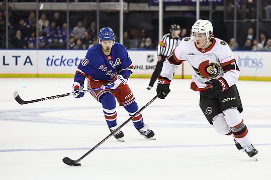 Nov 1, 2024; New York, New York, USA;  New York Rangers left wing Artemi Panarin (10) and Ottawa Senators center Ridly Greig (71) chase after the puck in the first period at Madison Square Garden. Mandatory Credit: Wendell Cruz-Imagn Images