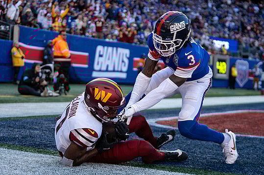 Washington Commanders wide receiver Terry McLaurin (17) catches a pass for a touchdown while being guarded by New York Giants cornerback Deonte Banks (3) during a game between the New York Giants and the Washington Commanders at MetLife Stadium in East Rutherford on Sunday, Nov. 3, 2024.
