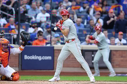 Oct 8, 2024; New York City, New York, USA; Philadelphia Phillies catcher J.T. Realmuto (10) is hit by a pitch in the second inning against the New York Mets during game three of the NLDS for the 2024 MLB Playoffs at Citi Field. Mandatory Credit: Brad Penner-Imagn Images
