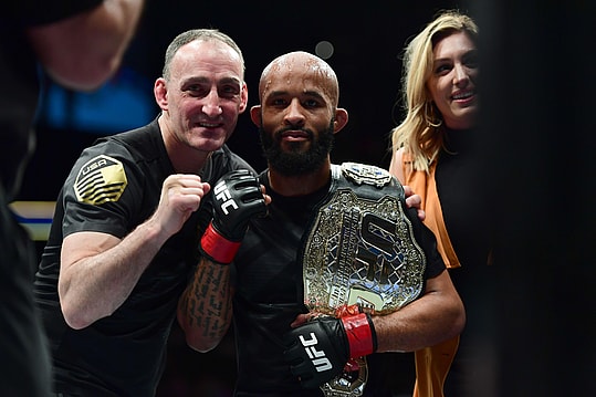 Apr 15, 2017; Kansas City, MO, USA; Demetrious Johnson (Red Gloves) following the win over and Wilson Reis (not pictured) during UFC Fight Night at Sprint Center. Mandatory Credit: Ron Chenoy-Imagn Images