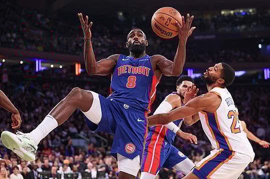 Dec 7, 2024; New York, New York, USA; Detroit Pistons forward Tim Hardaway Jr. (8) battles for a rebound against New York Knicks forward Mikal Bridges (25) during the second half at Madison Square Garden. Mandatory Credit: Vincent Carchietta-Imagn Images