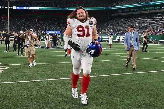 Aug 24, 2024; East Rutherford, New Jersey, USA; New York Giants defensive tackle Casey Rogers (91) jogs off the field following the game against the New York Jets at MetLife Stadium. Mandatory Credit: Rich Barnes-Imagn Images