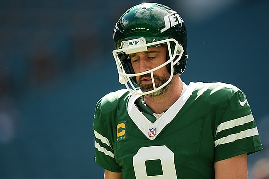 Dec 8, 2024; Miami Gardens, Florida, USA; New York Jets quarterback Aaron Rodgers (8) warms up prior to the game against the Miami Dolphins at Hard Rock Stadium. Mandatory Credit: Jasen Vinlove-Imagn Images