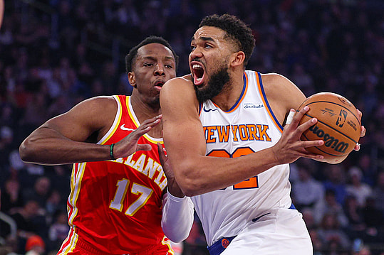 Jan 20, 2025; New York, New York, USA; New York Knicks center Karl-Anthony Towns (32) goes to the basket against Atlanta Hawks forward Onyeka Okongwu (17) during the first half at Madison Square Garden. Mandatory Credit: Vincent Carchietta-Imagn Images