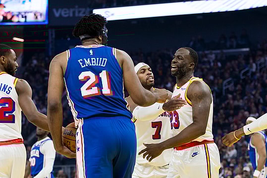 Jan 2, 2025; San Francisco, California, USA; Golden State Warriors forward Draymond Green (23) reacts after being fouled by Philadelphia 76ers center Joel Embiid (21) during the first quarter at Chase Center. Mandatory Credit: John Hefti-Imagn Images